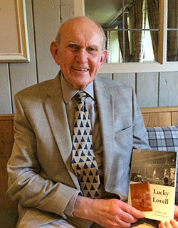Phil Lovell with his book Lucky Lovell